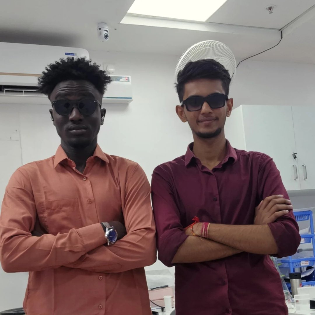 Anish with a colleague in a laboratory